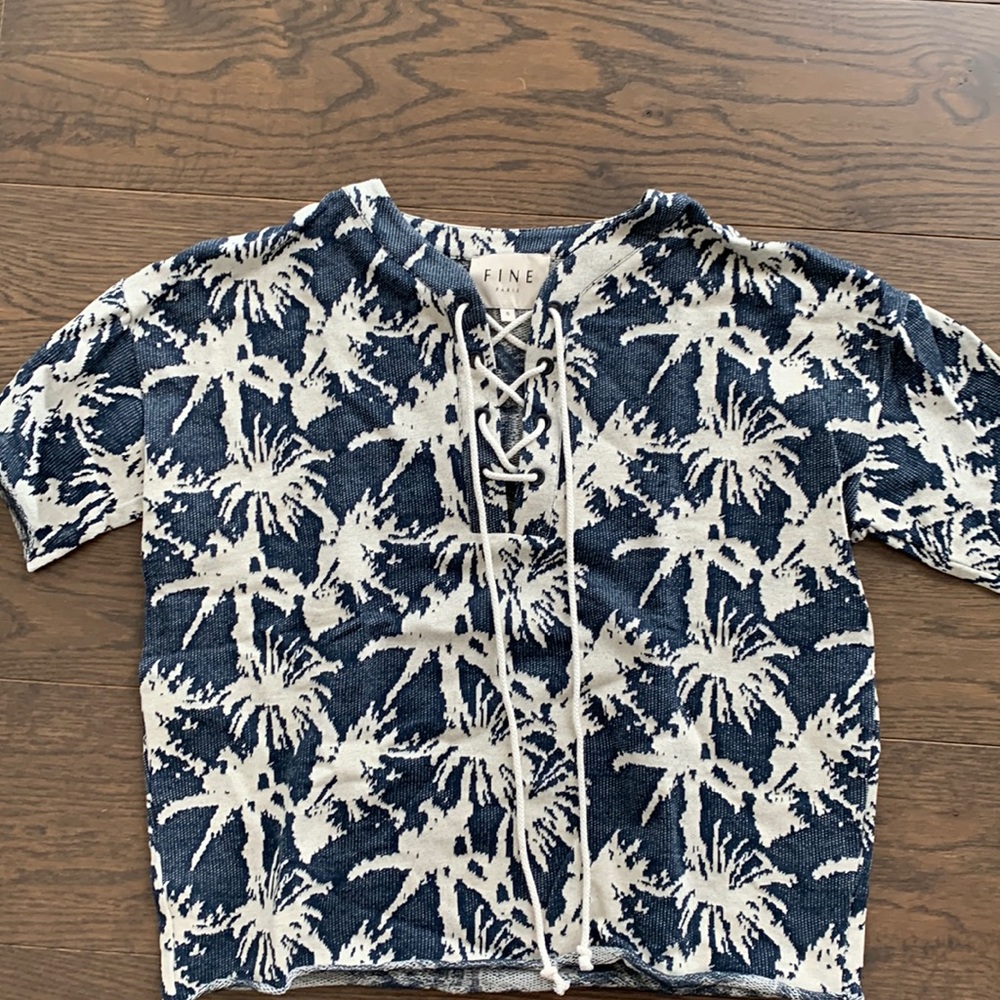 Knit top with palm leaf detail and crisscross neckline